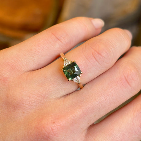Teal sapphire and diamond three-stone engagement ring