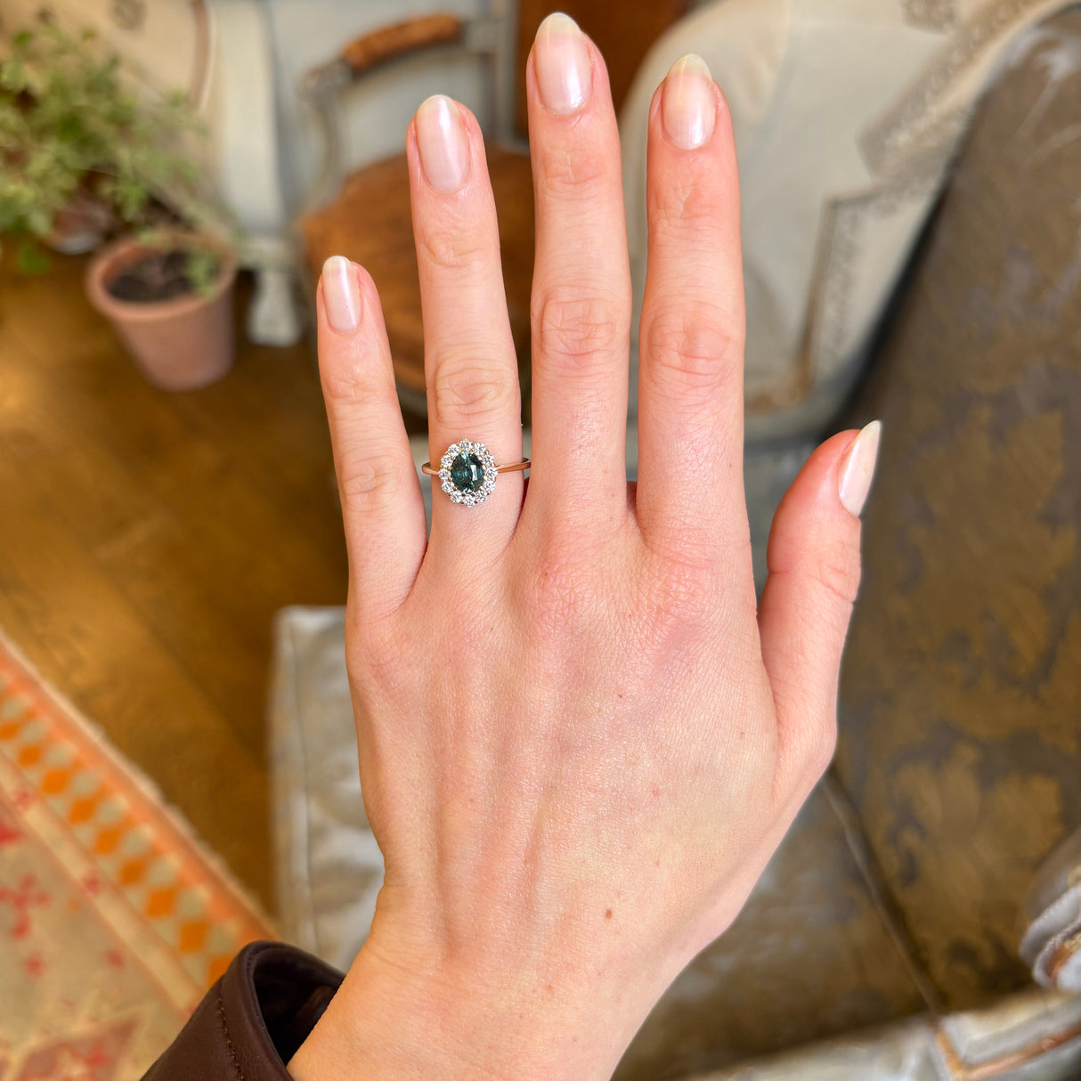 Green sapphire and diamond cluster engagement ring
