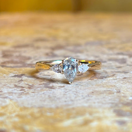Pear-cut diamond three-stone engagement ring