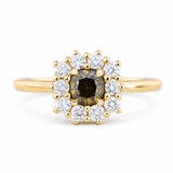 A close-up of an antique-inspired, Brown diamond halo cluster engagement ring in yellow gold.