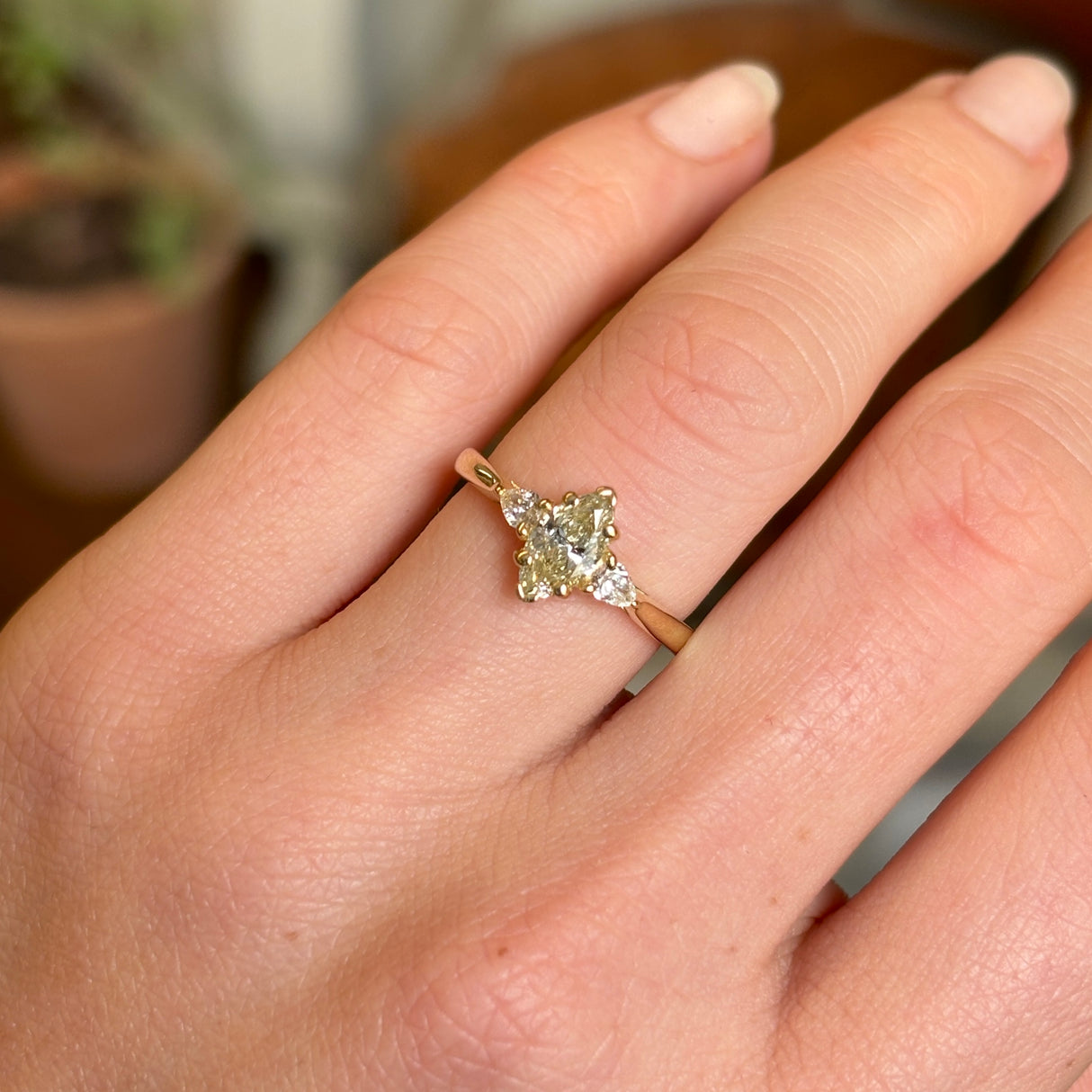 Marquise-cut diamond three-stone engagement ring