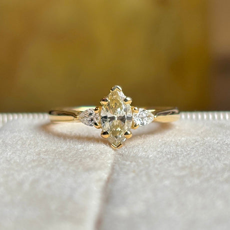Marquise-cut diamond three-stone engagement ring