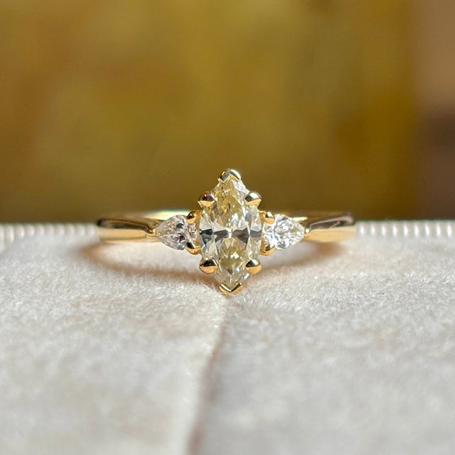 Marquise-cut diamond three-stone engagement ring
