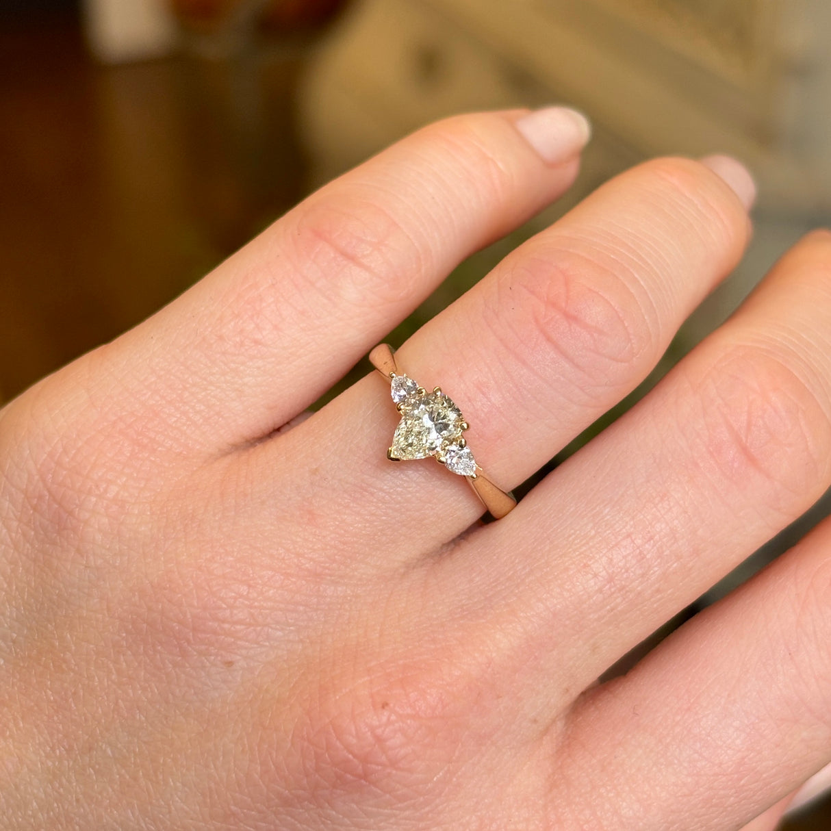 Pear-cut diamond three-stone engagement ring