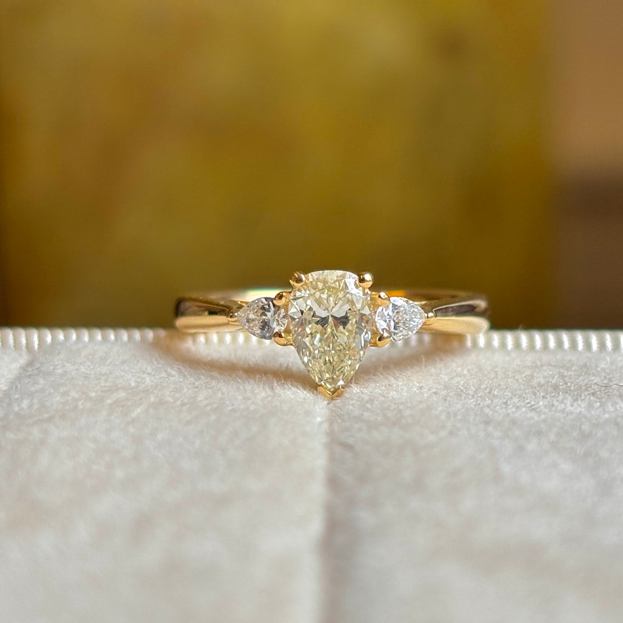 Pear-cut diamond three-stone engagement ring