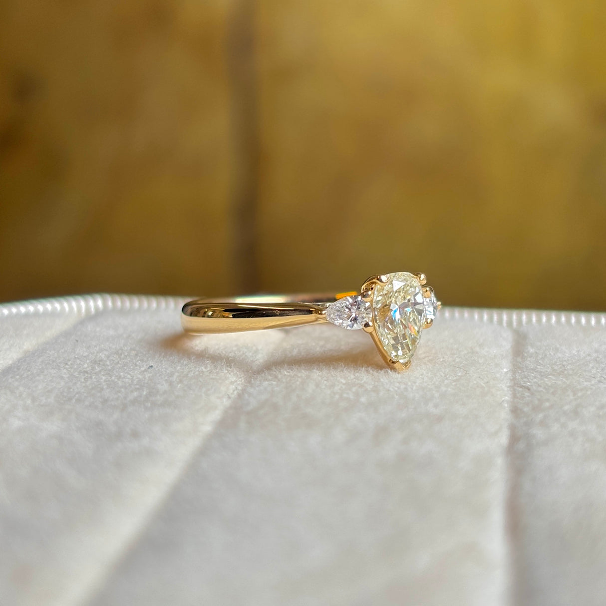 Pear-cut diamond three-stone engagement ring