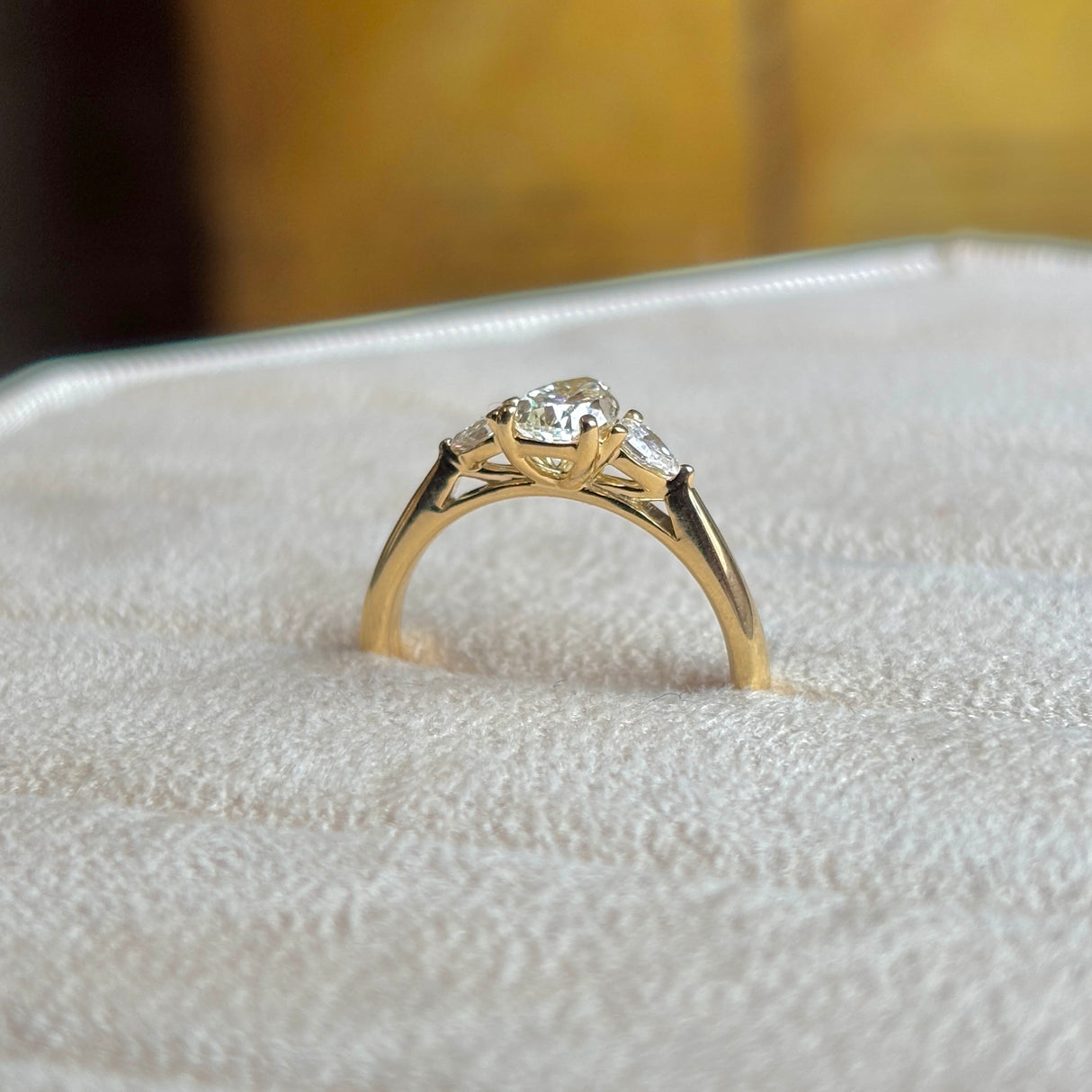 Pear-cut diamond three-stone engagement ring