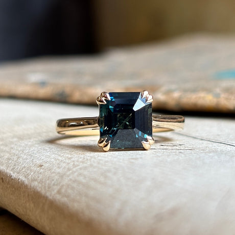 Square step-cut teal sapphire single-stone ring