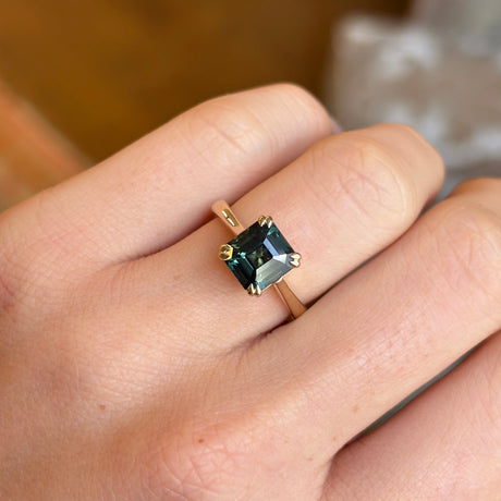 Square step-cut teal sapphire single-stone ring