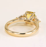 Emerald-cut yellow sapphire and diamond three-stone ring