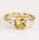 Emerald-cut yellow sapphire and diamond three-stone ring