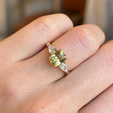 Emerald-cut yellow sapphire and diamond three-stone ring