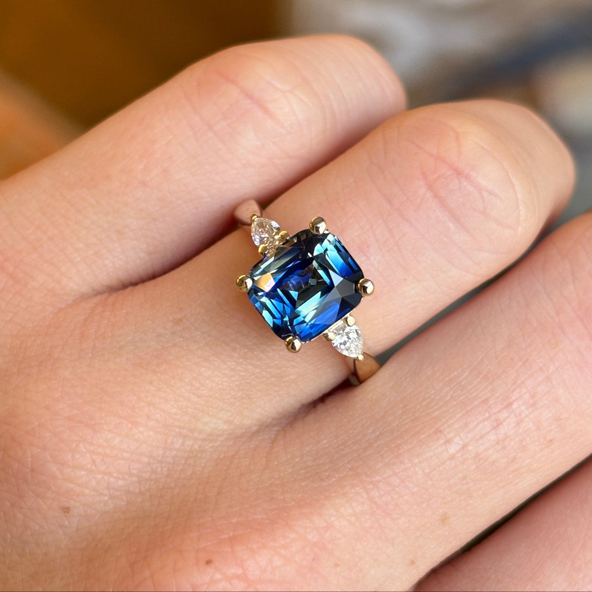 Bi-colour sapphire and diamond three-stone ring
