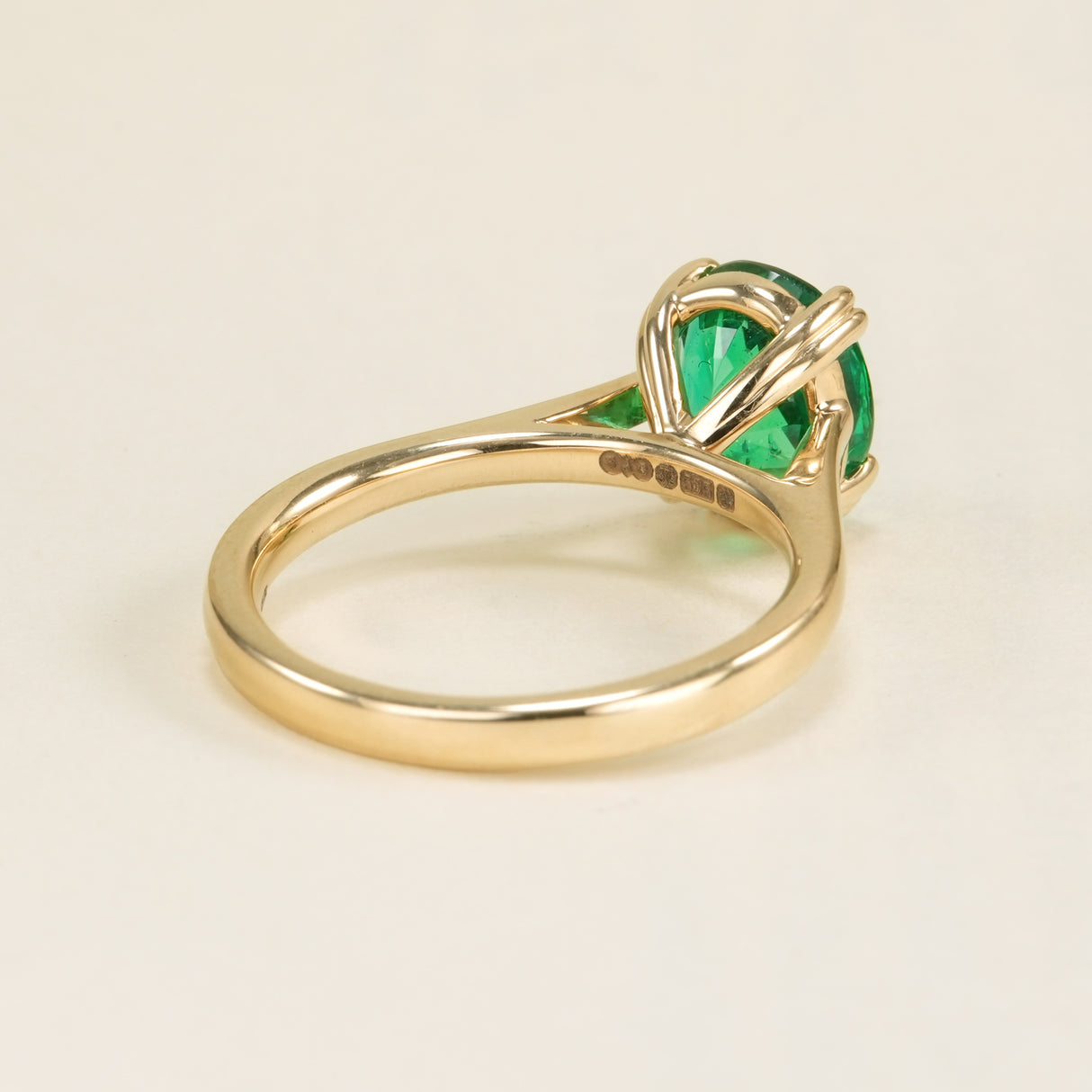 Oval-cut 2ct emerald single-stone ring