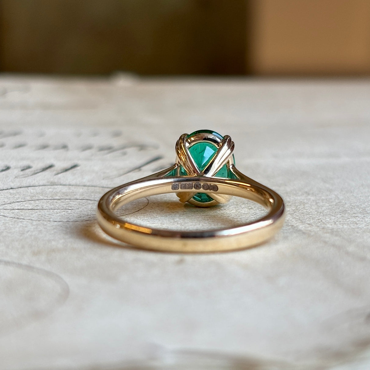 Oval-cut emerald single-stone ring