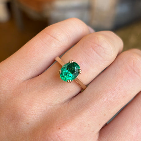 Oval-cut emerald single-stone ring