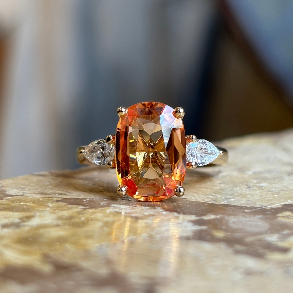 Old orange cushion-cut topaz & diamond three-stone ring