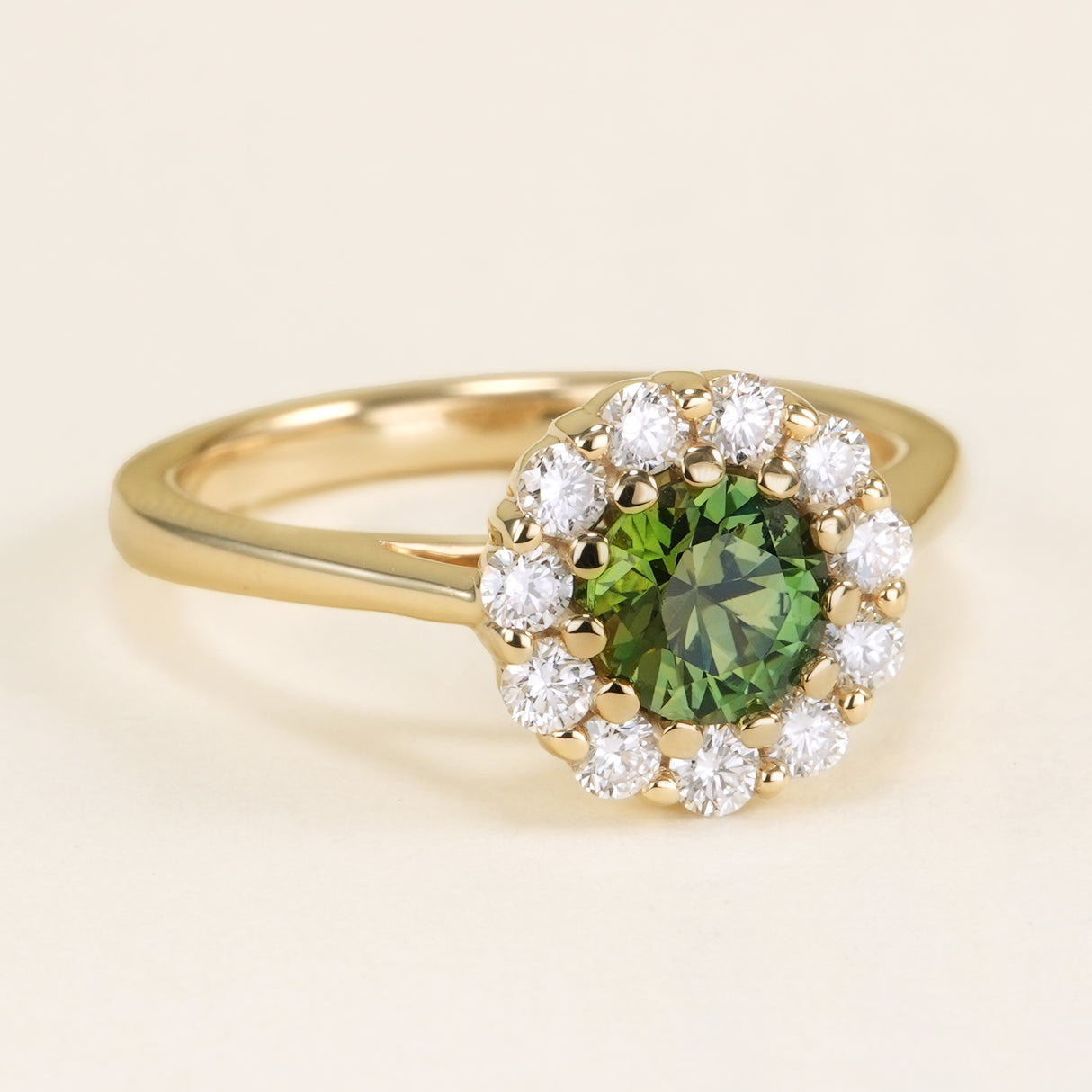 Green sapphire & diamond cluster engagement ring