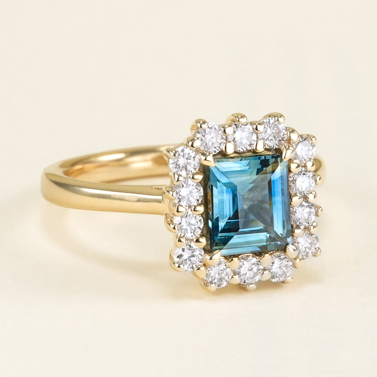 Square-cut teal green-blue sapphire & diamond cluster ring