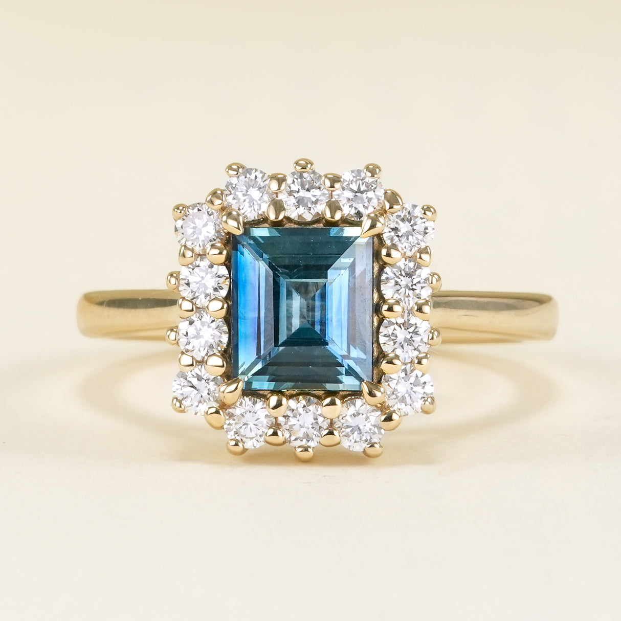Square-cut teal green-blue sapphire & diamond cluster ring