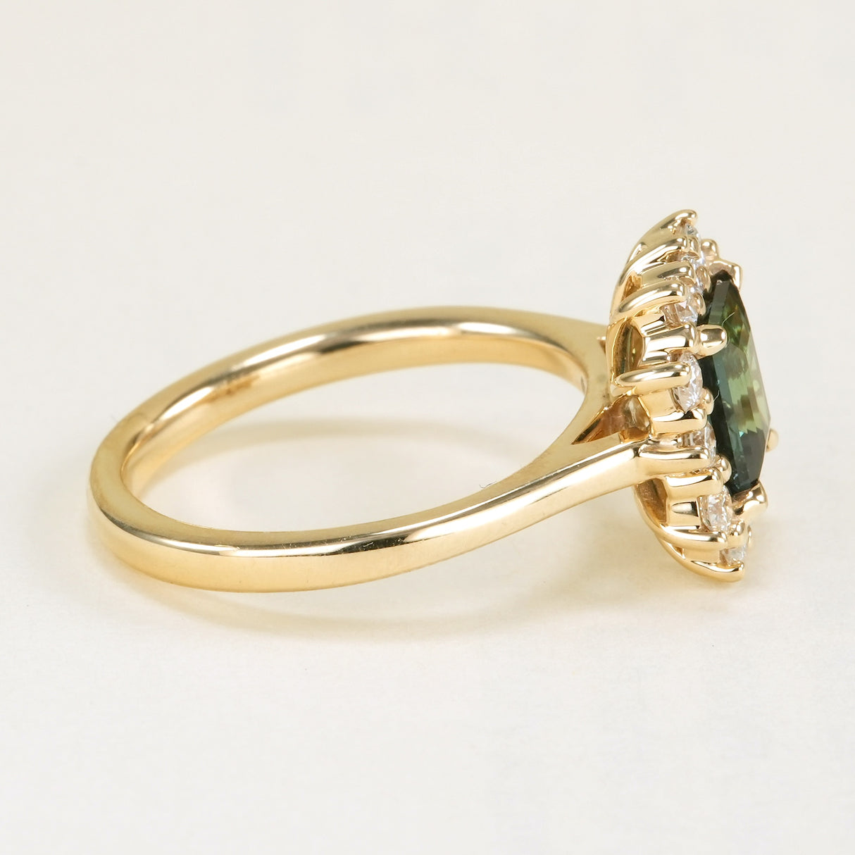 Square-cut teal sapphire & diamond cluster ring