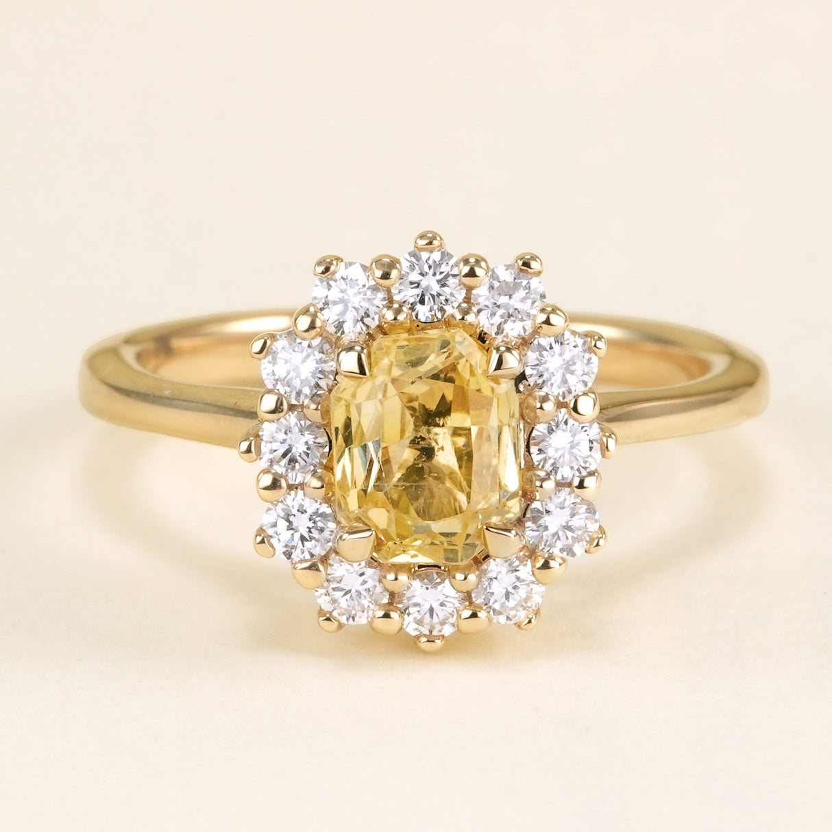 Yellow sapphire and diamond cluster engagement ring