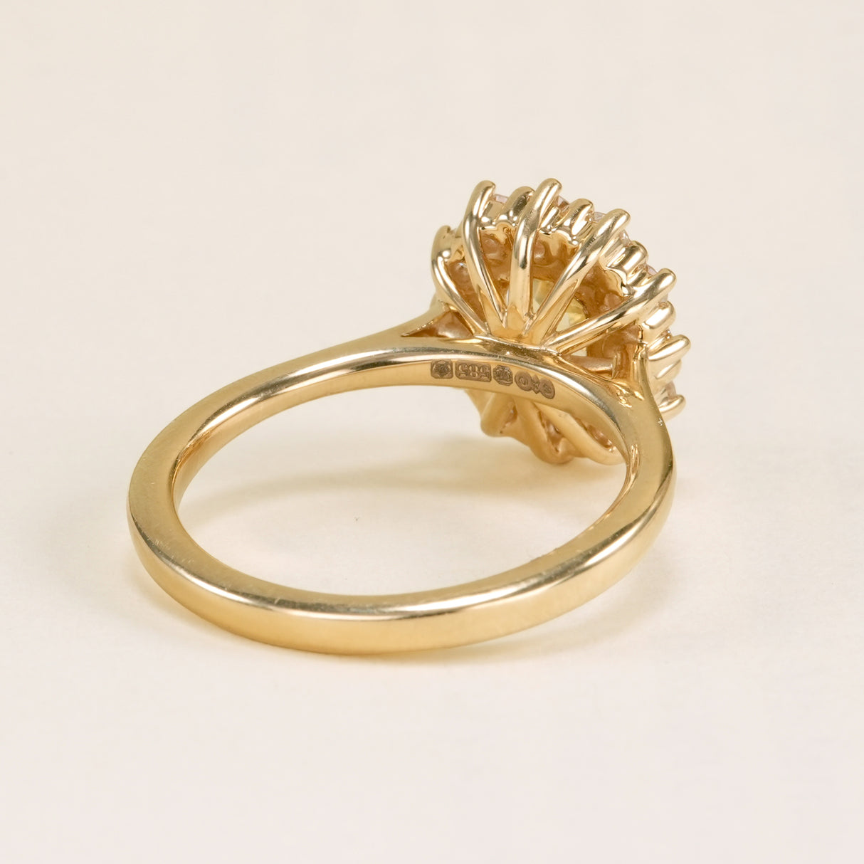 Yellow sapphire and diamond cluster engagement ring