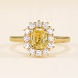 Yellow sapphire and diamond cluster engagement ring