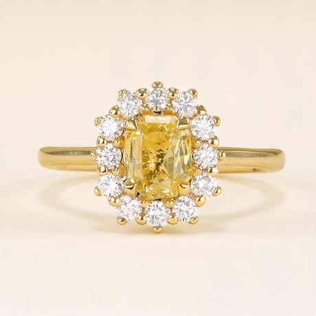 Yellow sapphire and diamond cluster engagement ring