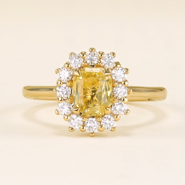 Yellow sapphire and diamond cluster engagement ring