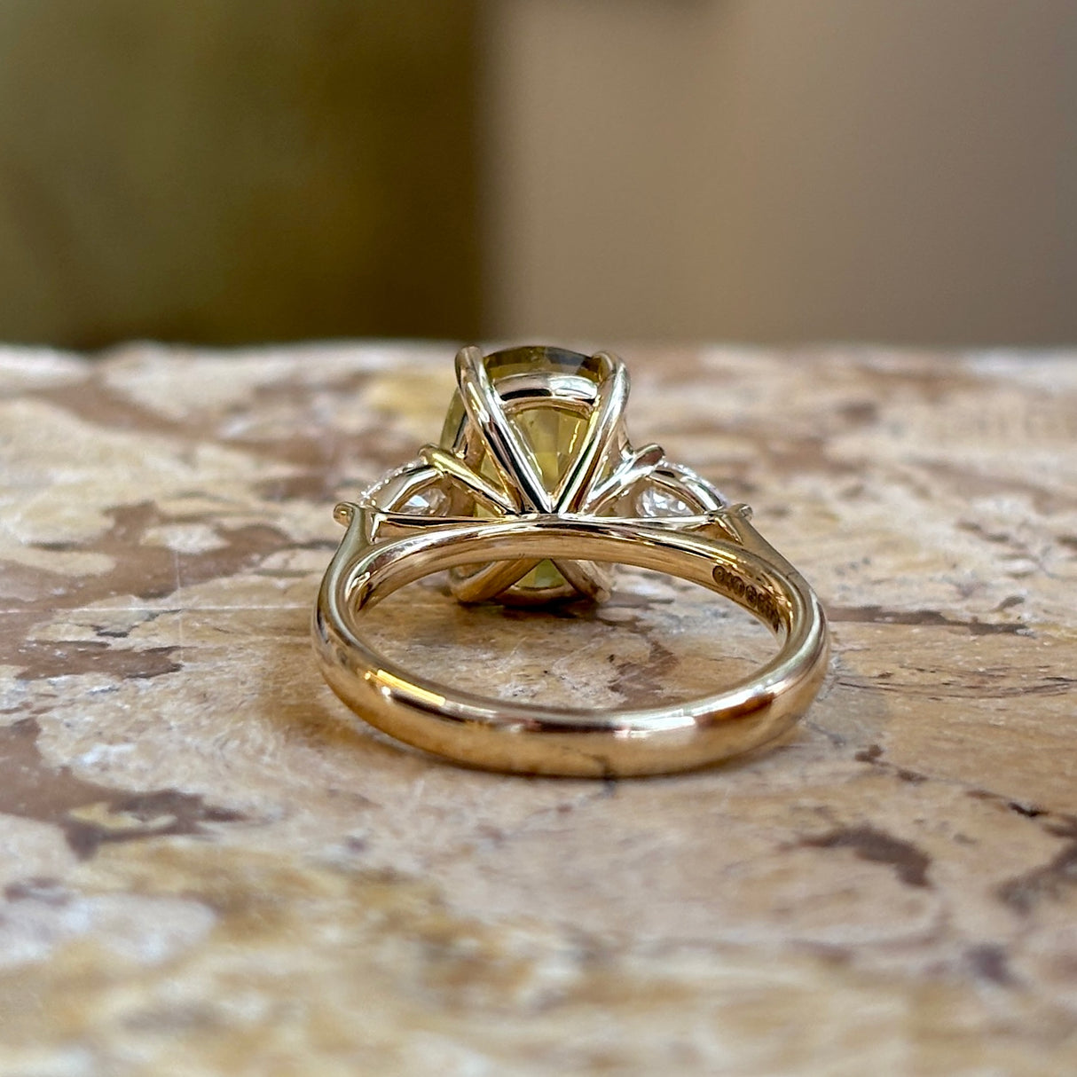 Chrysoberyl and pear-cut diamond three-stone ring