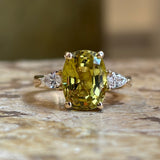 Chrysoberyl and pear-cut diamond three-stone ring