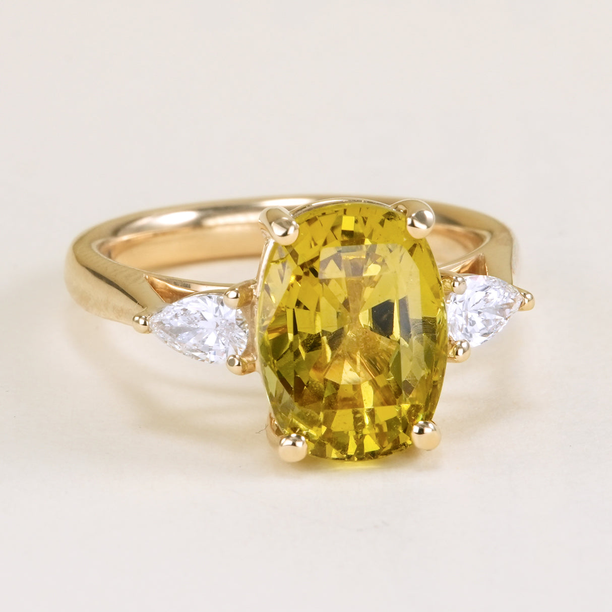 Chrysoberyl and pear-cut diamond three-stone ring