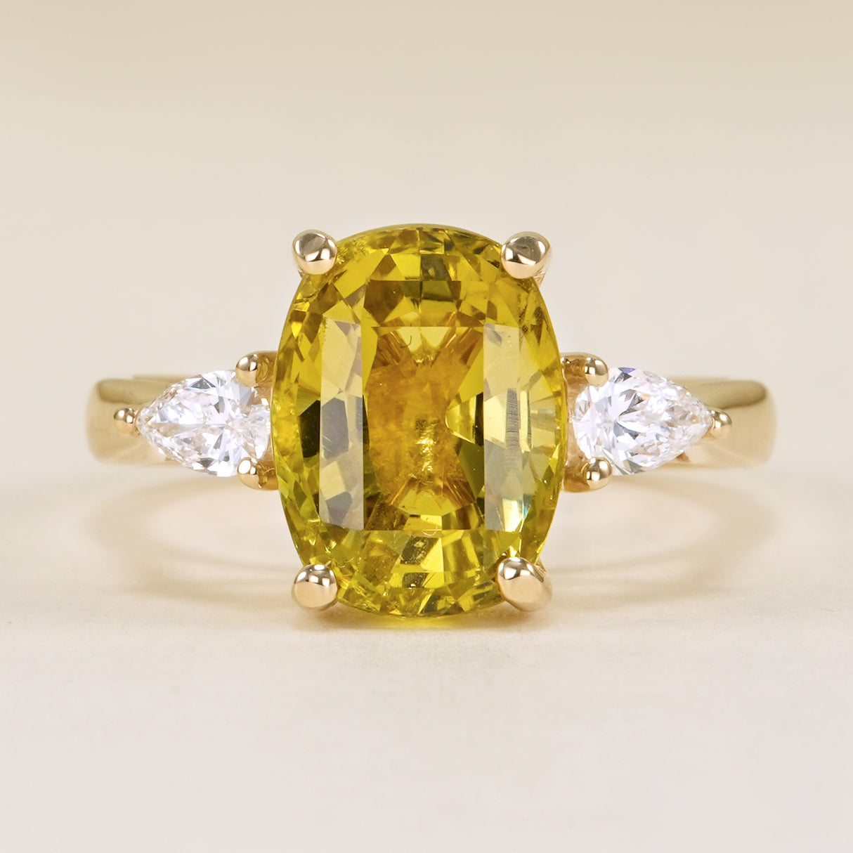 Chrysoberyl and pear-cut diamond three-stone ring
