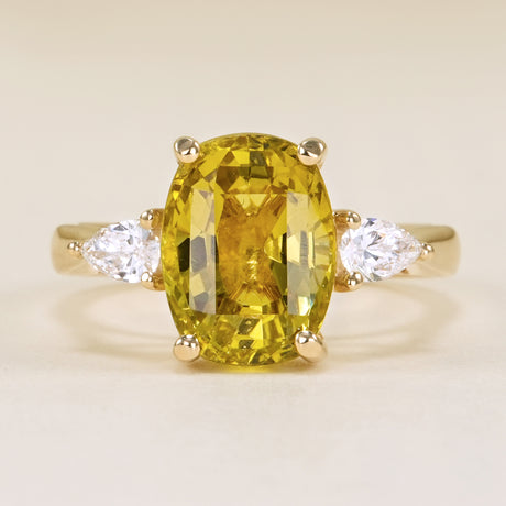 Chrysoberyl and pear-cut diamond three-stone ring