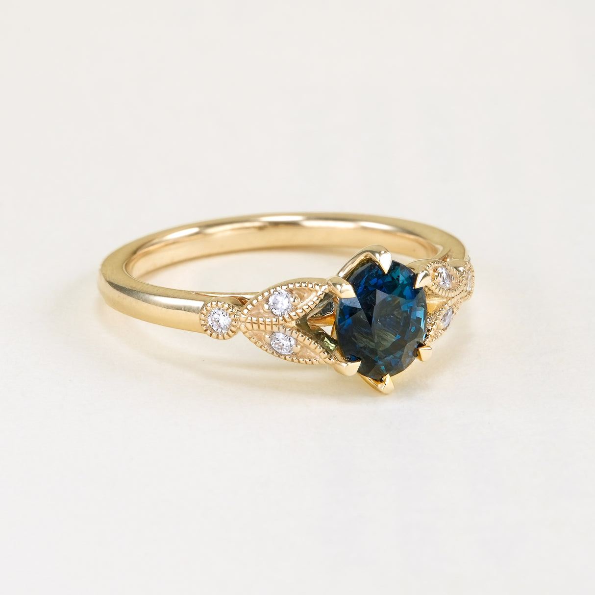Deep blue sapphire and diamond engagement ring