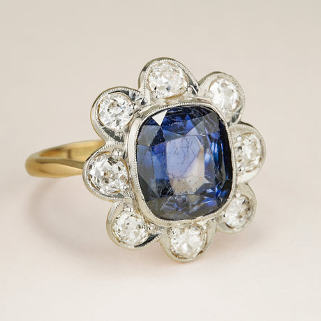 Antique, Edwardian 5ct cushion-cut sapphire & diamond daisy cluster ring
