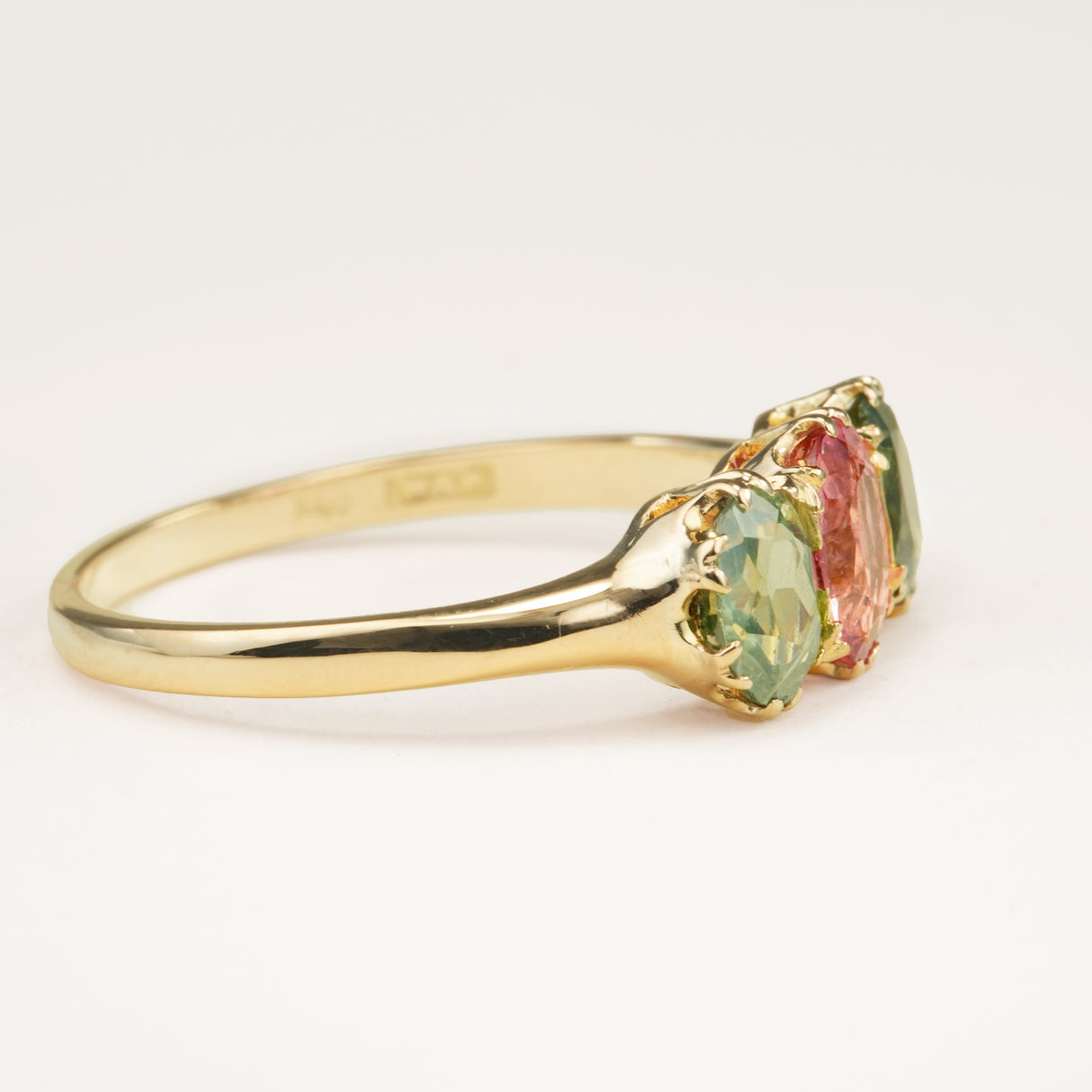 Antique, Edwardian pink tourmaline and green zircon three-stone engagement ring