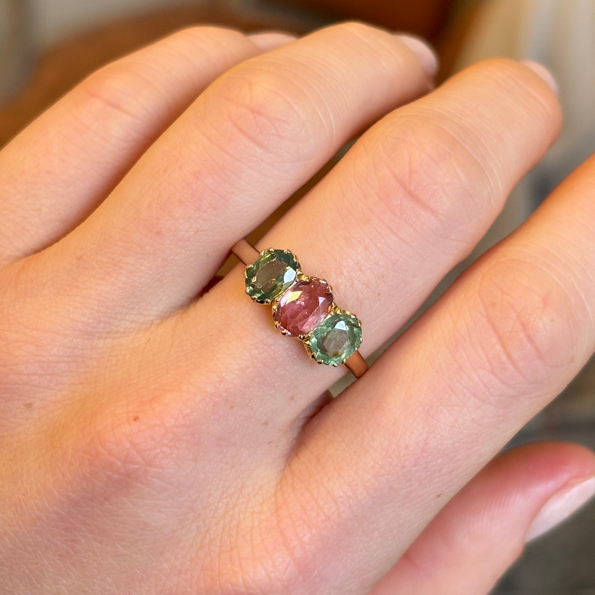 Antique, Edwardian pink tourmaline and green zircon three-stone ring