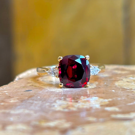 Ruby and diamond three-stone engagement ring