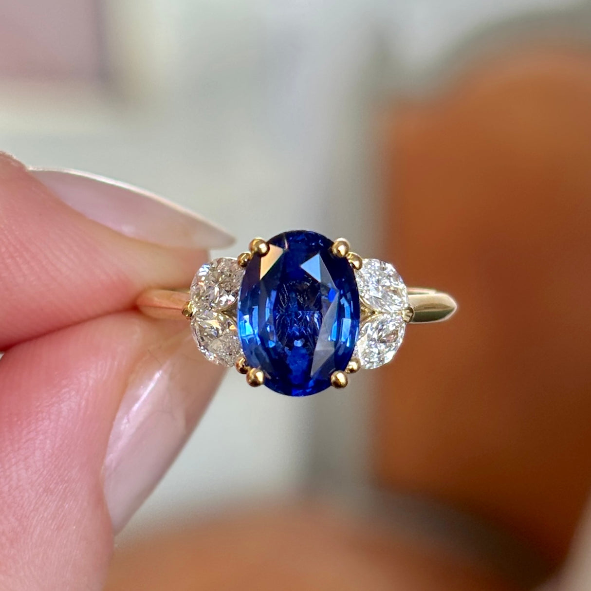Vintage, oval-cut sapphire and diamond engagement ring