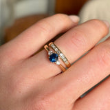 Blue sapphire and diamond three-stone engagement ring