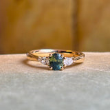 Teal sapphire and diamond three-stone engagement ring