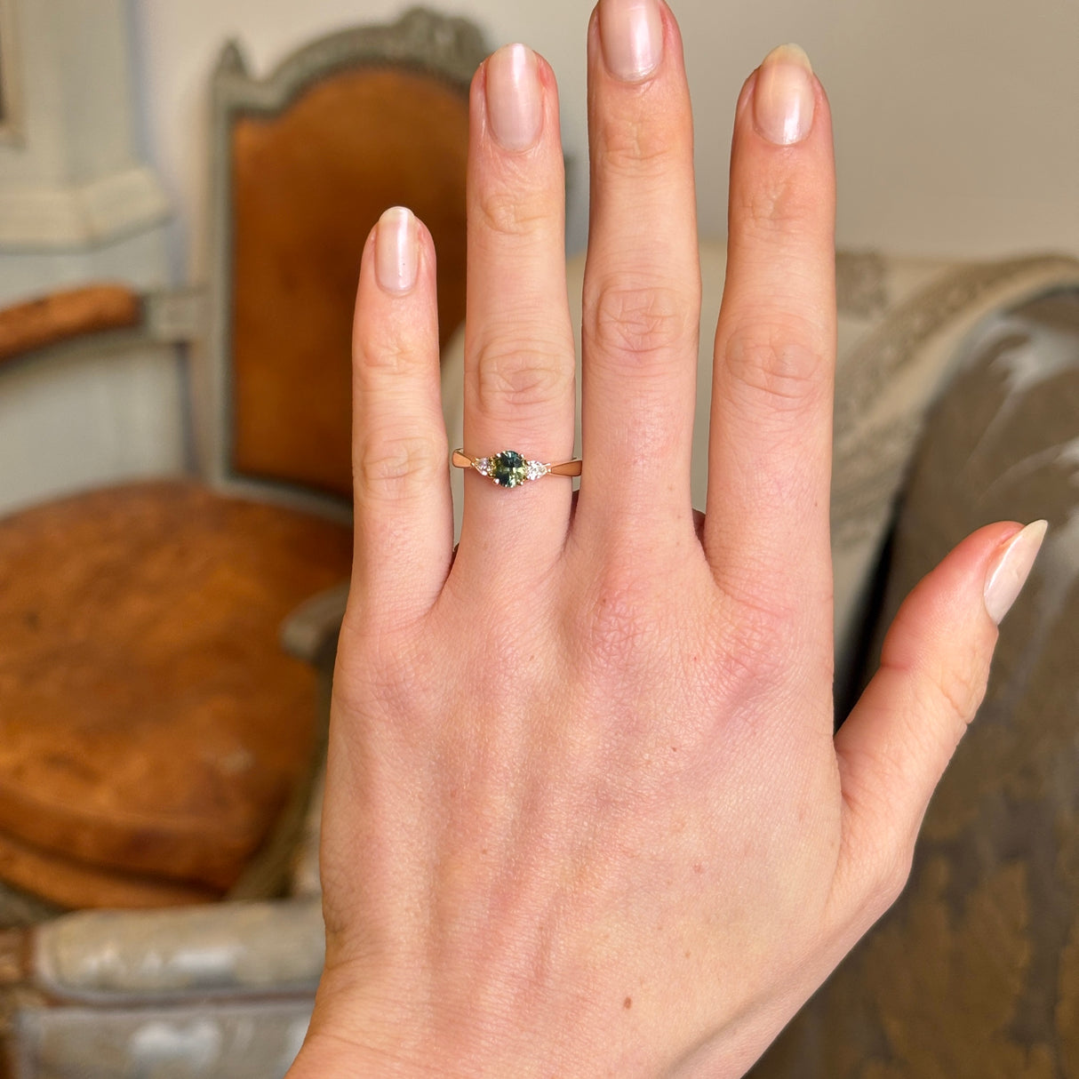 Teal sapphire and diamond three-stone engagement ring