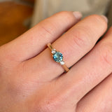 Teal sapphire and diamond three-stone engagement ring