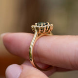 Gallery detail of an antique-inspired teal sapphire and diamond engagement ring in 14ct yellow gold.