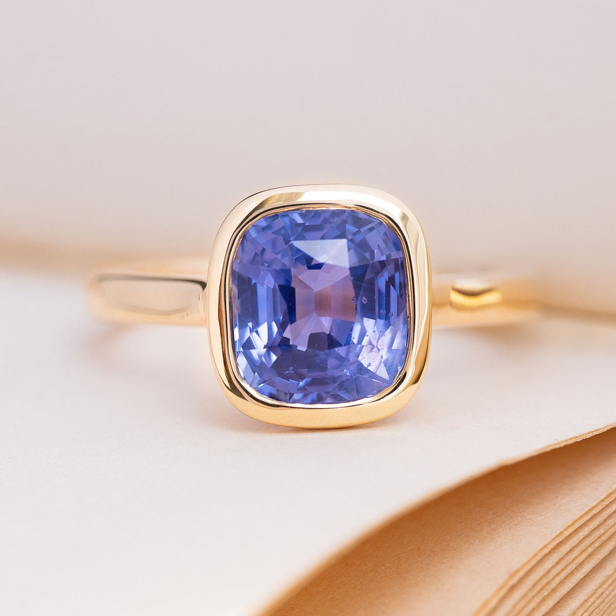 Antique-inspired, vivid violet sapphire solitaire engagement ring