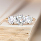 An antique, Edwardian old-cut diamond three-stone ring with 18ct yellow gold and platinum.