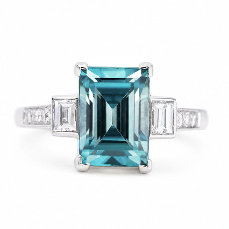 A close-up of an antique, Art Deco 1920s blue zircon & diamond ring in platinum.