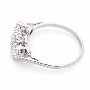 Angled view of an Edwardian three-stone diamond ring showing the gallery